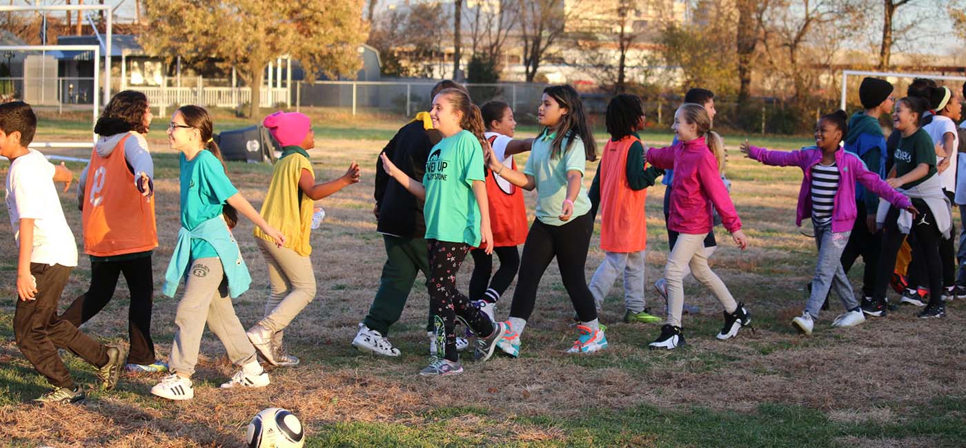 Soccer for Success Players Shaking Hands